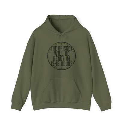 Green hoodie with white text "The Brisket will be ready in 12-18 Hours" and a a click graphic on a white background