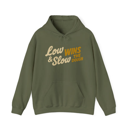 Green hoodie with text 'Low & Slow Wins the Dough' on a white background