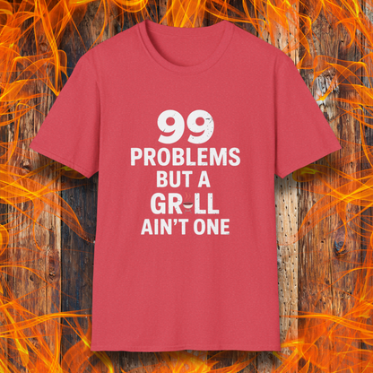 Heather Red T-shirt with bold white text that says "99 Problems But a Grill Ain’t One," featuring a small red grill icon replacing the "I" in "Grill" — a playful shirt for BBQ fans and grilling pros.
