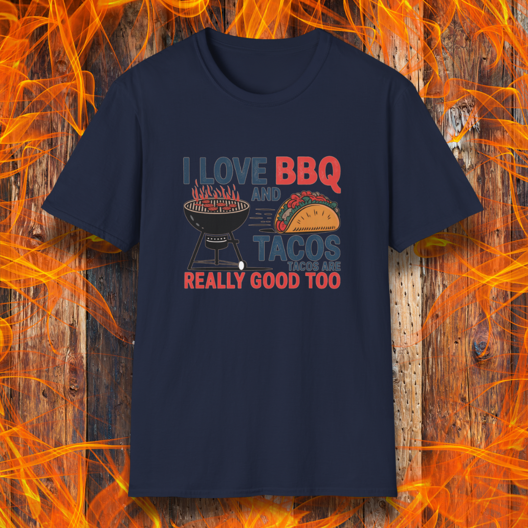 Navy T-shirt features a fun and bold design that reads, "I Love BBQ and Tacos... Tacos Are Really Good Too," with graphics of a flaming grill and a delicious taco. Perfect for BBQ lovers who also enjoy a good taco, this shirt combines humor and food passion in a stylish way.