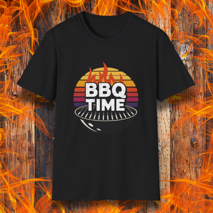 Black T-shirt featuring a bold "BBQ TIME" design with a retro sunset background, flames, and a charcoal grill illustration. Perfect for barbecue lovers and grill masters.