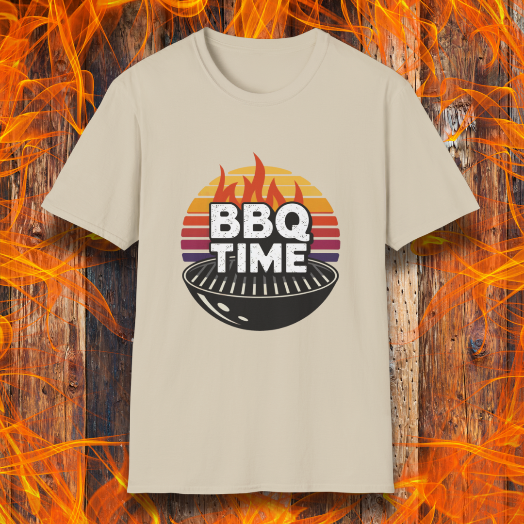 Sand T-shirt featuring a bold "BBQ TIME" design with a retro sunset background, flames, and a charcoal grill illustration. Perfect for barbecue lovers and grill masters.