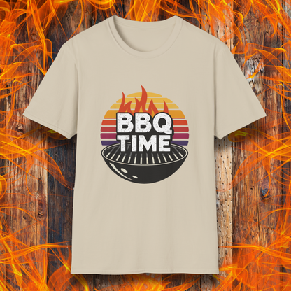 Sand T-shirt featuring a bold "BBQ TIME" design with a retro sunset background, flames, and a charcoal grill illustration. Perfect for barbecue lovers and grill masters.