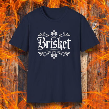 Navy t-shirt with elegant white gothic-style “Brisket” text framed by ornate flourishes—where BBQ obsession meets old-school swagger.