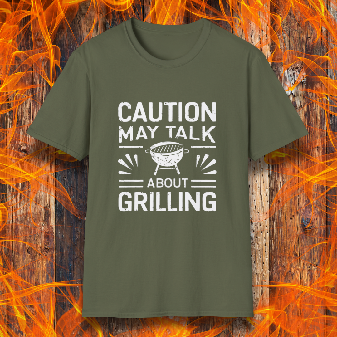Military Green T-shirt featuring bold white text that reads 'CAUTION MAY TALK ABOUT GRILLING,' with a vintage-style BBQ grill illustration and decorative lines. Perfect for passionate grill masters who can't stop talking about barbecue.