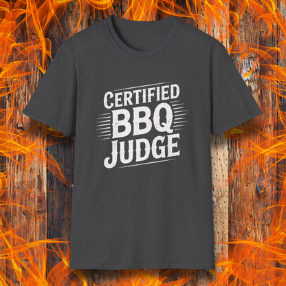 Bold "Certified BBQ Judge" graphic in distressed white text on a dark heather t-shirt, perfect for BBQ-themed apparel or promotional use.