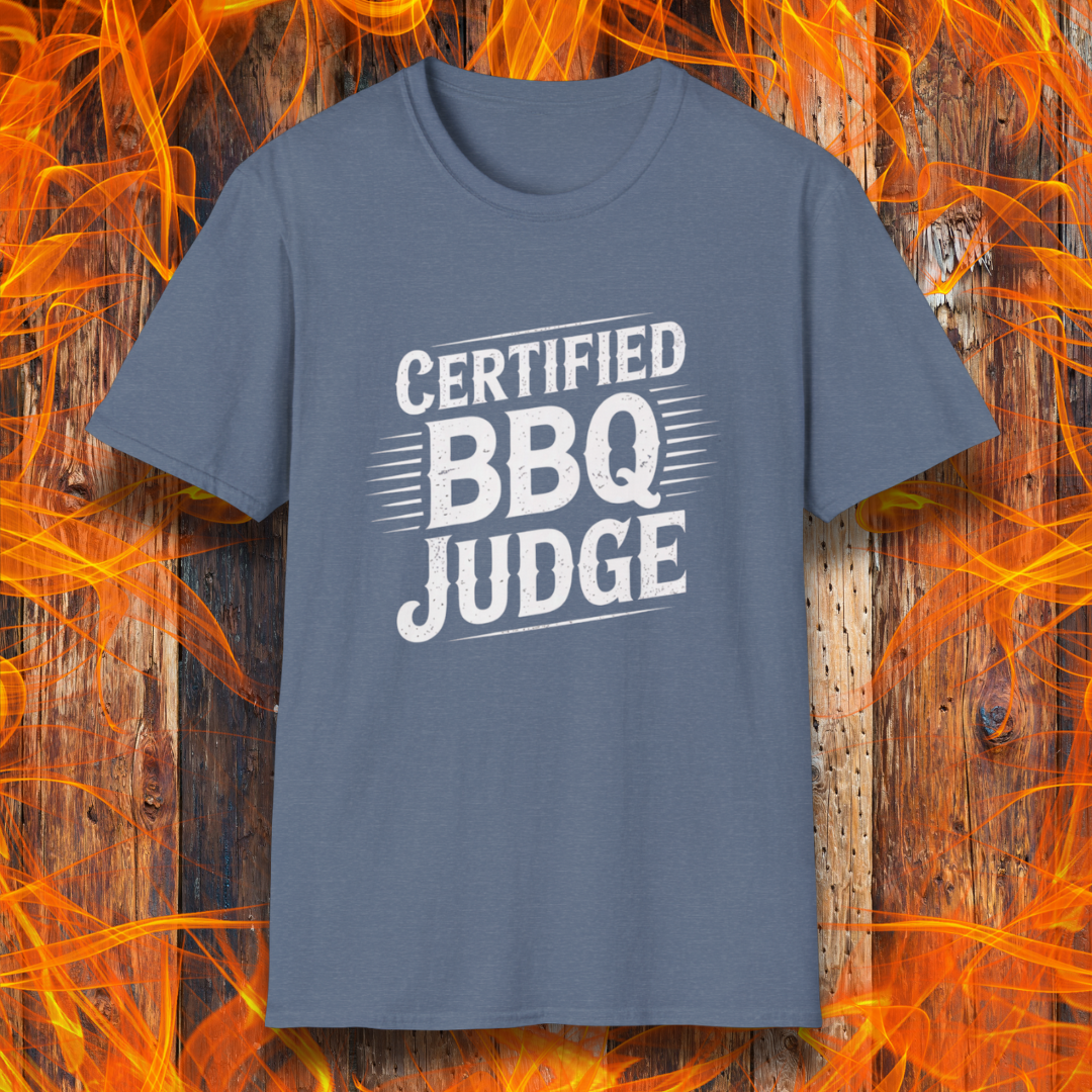 Bold "Certified BBQ Judge" graphic in distressed white text on a heather indigo t-shirt, perfect for BBQ-themed apparel or promotional use.