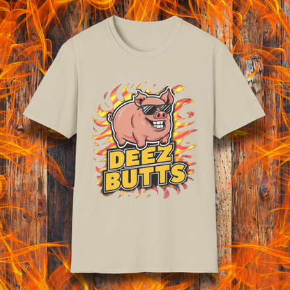 Sand T-Shirt showcasing a pig with sunglasses and the phrase "Deez Butts" sitting below the pig in bold yellow lettering.