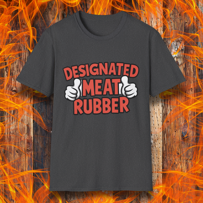 Dark Heather T-shirt featuring bold text reading 'Designated Meat Rubber' with two thumbs-up graphics, a humorous BBQ-themed design for grill masters and barbecue lovers.