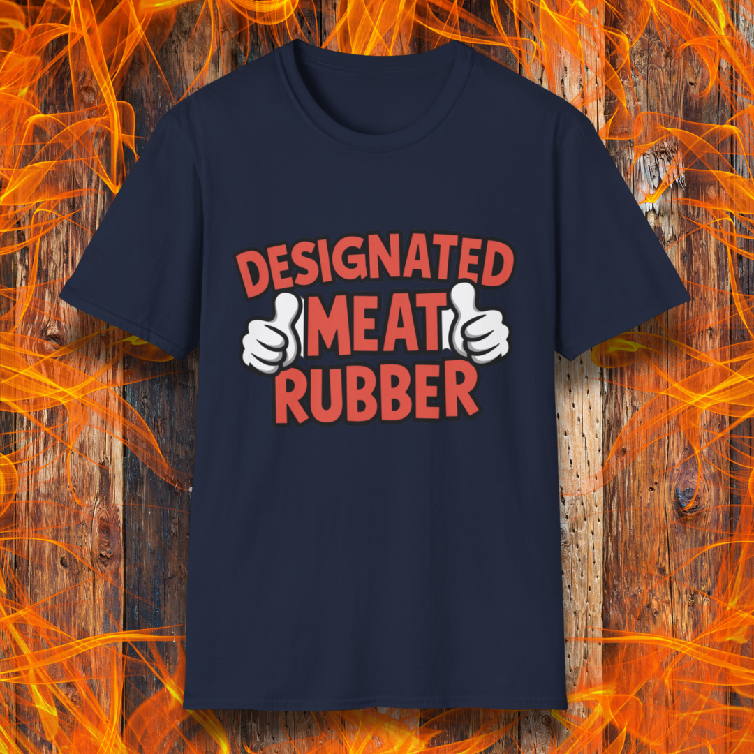 Navy T-shirt featuring bold text reading 'Designated Meat Rubber' with two thumbs-up graphics, a humorous BBQ-themed design for grill masters and barbecue lovers.