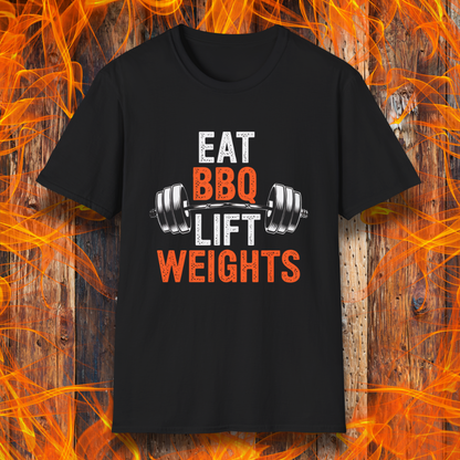 Black T-shirt featuring a bold fitness-inspired design with the phrase 'Eat BBQ Lift Weights' alongside a barbell graphic. Perfect for barbecue lovers who also enjoy hitting the gym and staying strong while indulging in their favorite grilled meats."