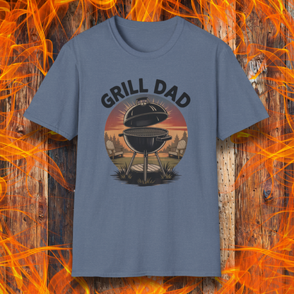 Heather Indigo t-shirt with 'Grill Dad' graphic on a wooden background with flames.