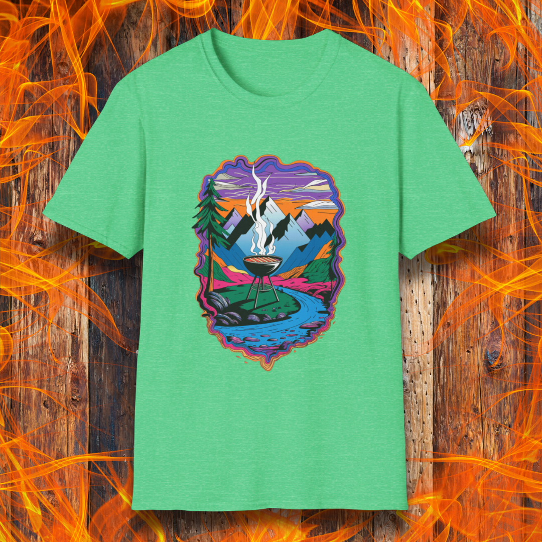 Heather Irish Green T-shirt featuring a vibrant and artistic illustration of a scenic mountain landscape with a smoking grill at the center, surrounded by a flowing river, pine trees, and a colorful sky. The design evokes a love for outdoor grilling and adventure, making it a perfect choice for BBQ and nature enthusiasts.