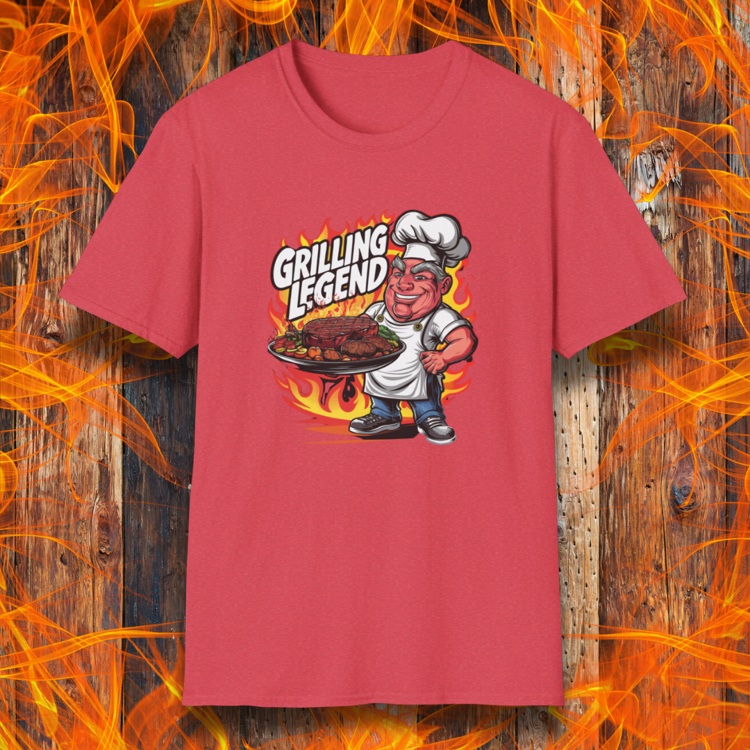 Heather Red t-shirt featuring a cartoon-style chef character holding a platter of perfectly grilled meats, with flames in the background and bold text that reads 'Grilling Legend'—ideal for BBQ masters and pit bosses
