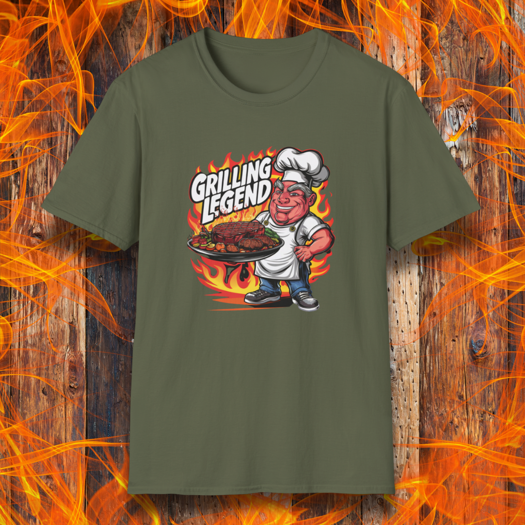 Military Green t-shirt featuring a cartoon-style chef character holding a platter of perfectly grilled meats, with flames in the background and bold text that reads 'Grilling Legend'—ideal for BBQ masters and pit bosses