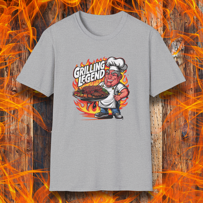 Sport Grey t-shirt featuring a cartoon-style chef character holding a platter of perfectly grilled meats, with flames in the background and bold text that reads 'Grilling Legend'—ideal for BBQ masters and pit bosses