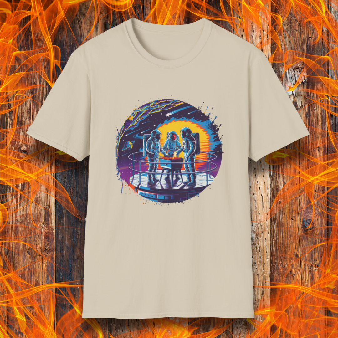 Sand T-shirt showcases a vibrant, futuristic design featuring astronauts grilling in space. The scene is set on a metallic space station platform, with a cosmic backdrop of planets, stars, and a fiery explosion. The detailed artwork blends sci-fi with BBQ culture, making it a perfect choice for grilling enthusiasts who love a unique, out-of-this-world theme.