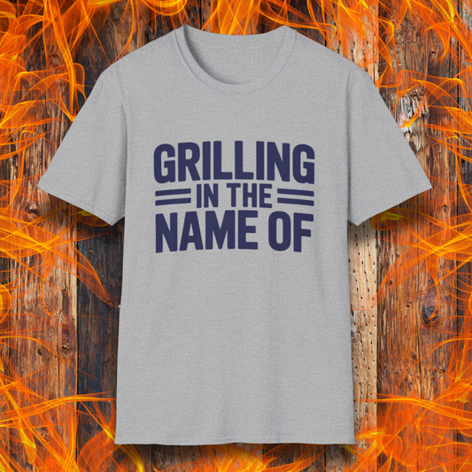 Sport Grey T-shirt with bold Navy text that reads "Grilling in the Name Of" in a stacked, block-style font — a humorous BBQ-themed shirt for grilling enthusiasts.