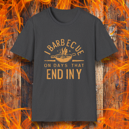 Dark Heather T-shirt with 'I Barbecue on Days That End in Y' in bold, rustic orange lettering, featuring a steaming grill pan graphic. Perfect for grill masters who believe every day is BBQ day!