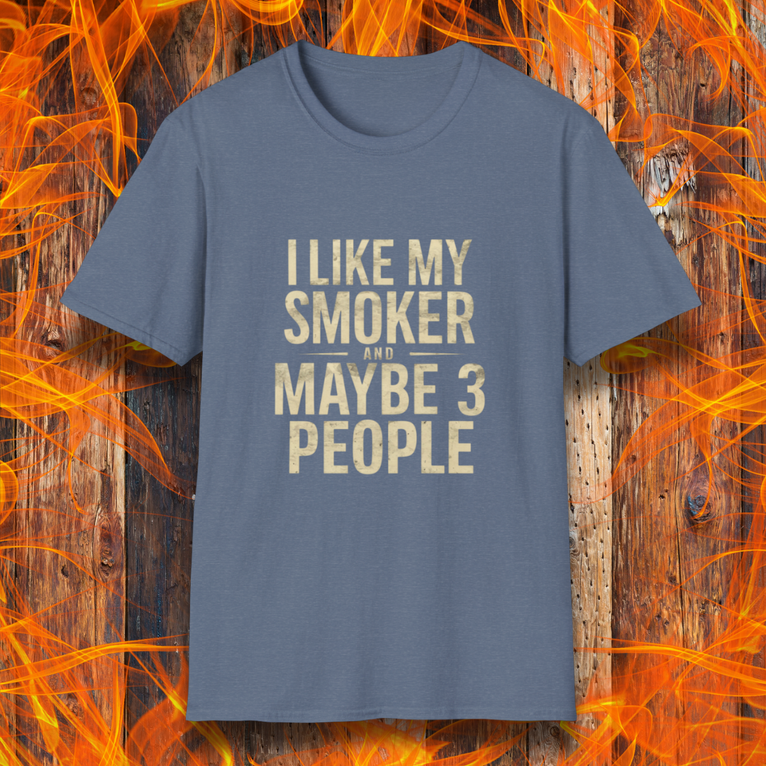 Heather Indigo T-shirt featuring bold, distressed beige text that reads, 'I Like My Smoker And Maybe 3 People.' A humorous BBQ-themed shirt perfect for pitmasters and grilling enthusiasts who prefer the company of their smoker over most people!