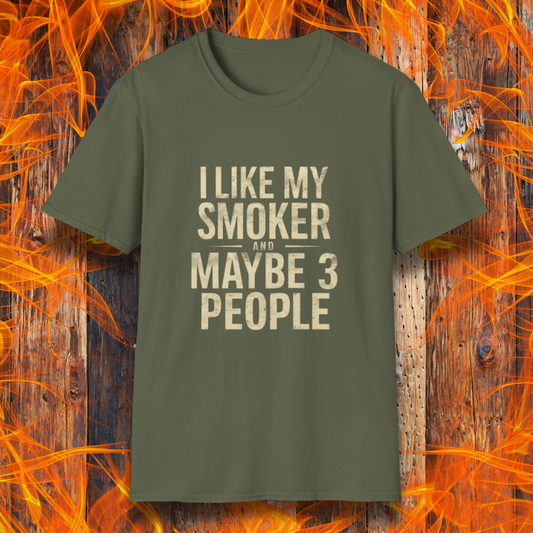 Military Green T-shirt featuring bold, distressed beige text that reads, 'I Like My Smoker And Maybe 3 People.' A humorous BBQ-themed shirt perfect for pitmasters and grilling enthusiasts who prefer the company of their smoker over most people!
