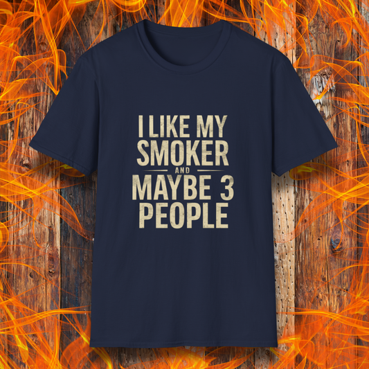 Navy T-shirt featuring bold, distressed beige text that reads, 'I Like My Smoker And Maybe 3 People.' A humorous BBQ-themed shirt perfect for pitmasters and grilling enthusiasts who prefer the company of their smoker over most people!