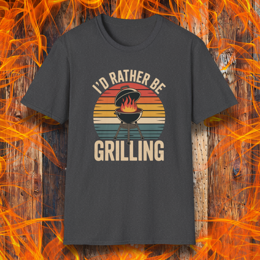 Dark Heather t-shirt with 'I'd Rather Be Grilling' graphic on a wooden background with flames.