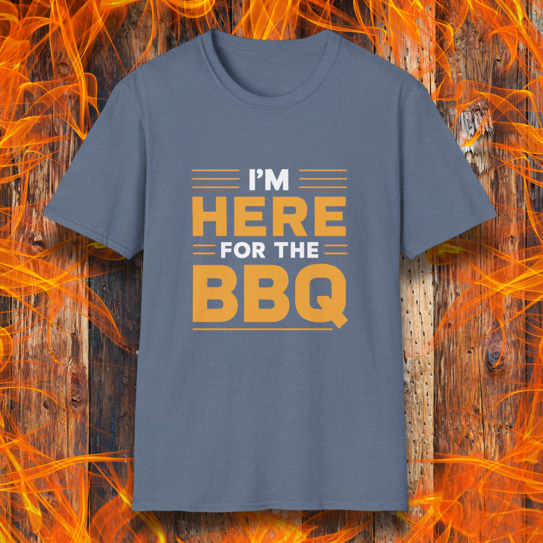 Heather Indigo T-shirt with bold text reading 'I'M HERE FOR THE BBQ' in orange and white, accented with horizontal lines for emphasis. A stylish and fun design for BBQ lovers and grill masters.