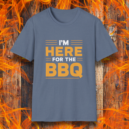 Heather Indigo T-shirt with bold text reading 'I'M HERE FOR THE BBQ' in orange and white, accented with horizontal lines for emphasis. A stylish and fun design for BBQ lovers and grill masters.