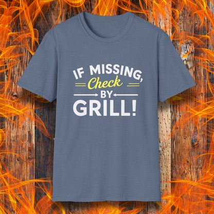 Heather Indigo T-shirt featuring a fun BBQ-themed design. The bold white and yellow text reads 'IF MISSING, Check BY GRILL!' with decorative arrows and highlights, making it the perfect shirt for grill masters who are always found tending to the flames.