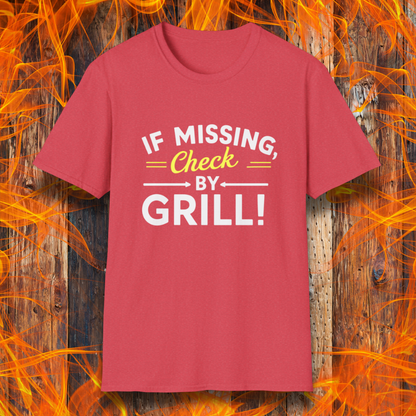 Heather Red T-shirt featuring a fun BBQ-themed design. The bold white and yellow text reads 'IF MISSING, Check BY GRILL!' with decorative arrows and highlights, making it the perfect shirt for grill masters who are always found tending to the flames.