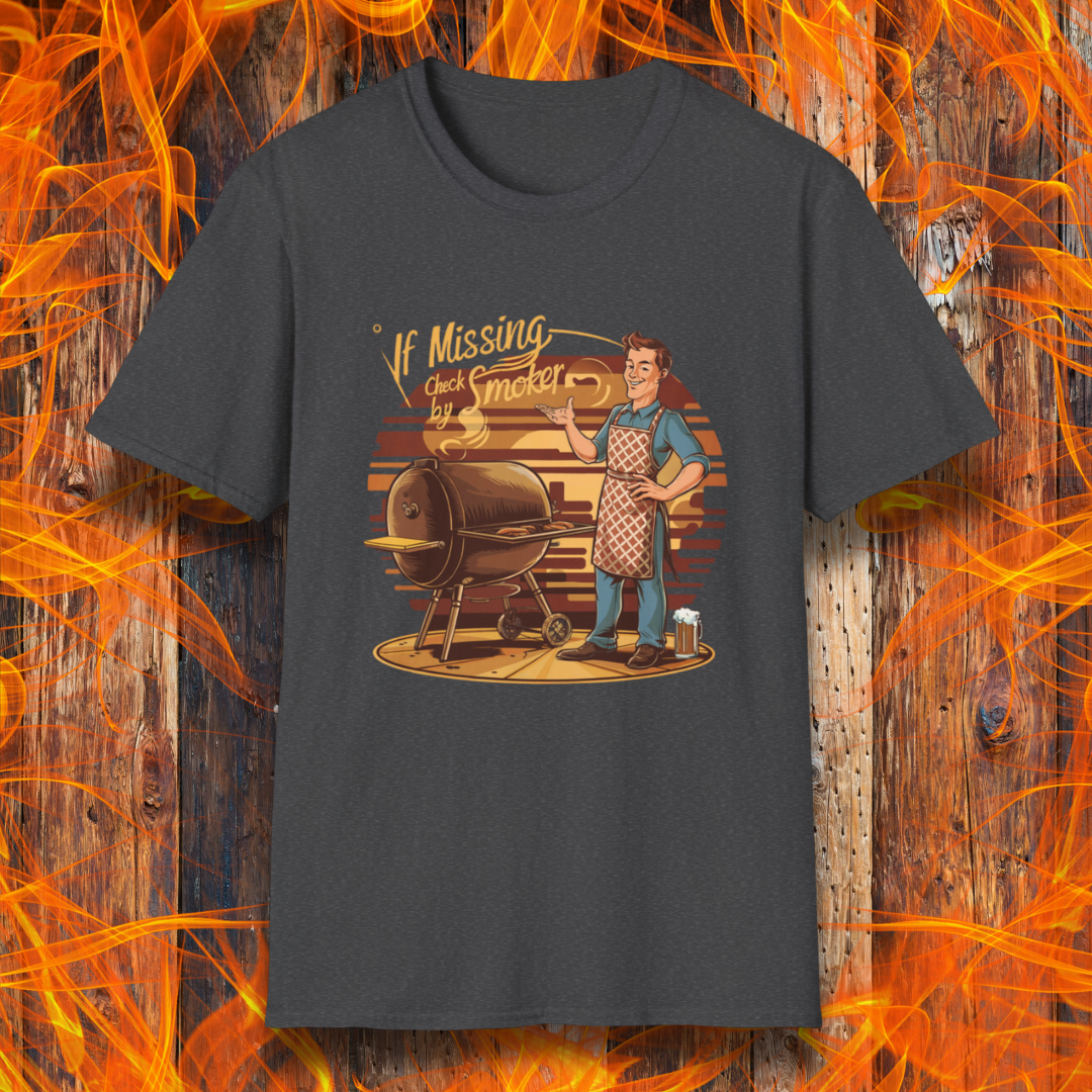 Dark Heather  t-shirt featuring a retro-style illustration of a man grilling next to a smoker, with the phrase 'If Missing, Check by Smoker,' displayed against a fiery wooden background."