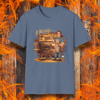 Heather Indigo  t-shirt featuring a retro-style illustration of a man grilling next to a smoker, with the phrase 'If Missing, Check by Smoker,' displayed against a fiery wooden background."