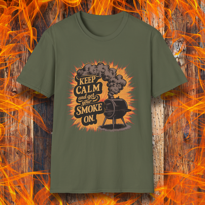 Military Green t-shirt featuring a vintage-style illustration of a smoker grill with smoke billowing out, alongside the phrase 'Keep Calm and Get Your Smoke On' in bold typography.