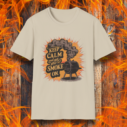 Sand t-shirt featuring a vintage-style illustration of a smoker grill with smoke billowing out, alongside the phrase 'Keep Calm and Get Your Smoke On' in bold typography.