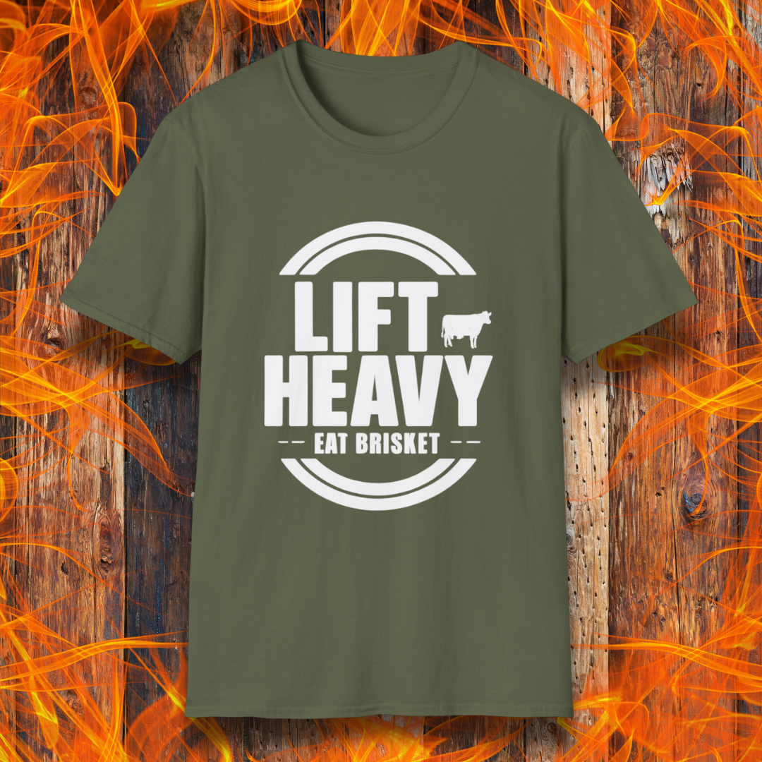 Military Green colored T-shirt with "LIFT HEAVY EAT BRISKET" in bold text and a cow silhouette. Perfect for BBQ lovers, gym-goers, and meat-smoking enthusiasts.