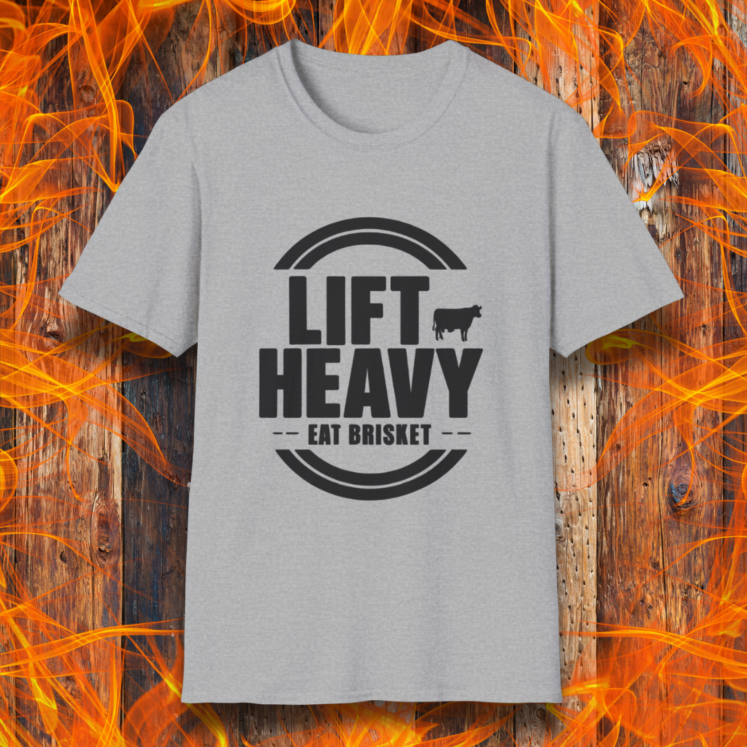 Sport Grey colored T-shirt with "LIFT HEAVY EAT BRISKET" in bold text and a cow silhouette. Perfect for BBQ lovers, gym-goers, and meat-smoking enthusiasts.
