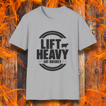 Sport Grey colored T-shirt with "LIFT HEAVY EAT BRISKET" in bold text and a cow silhouette. Perfect for BBQ lovers, gym-goers, and meat-smoking enthusiasts.