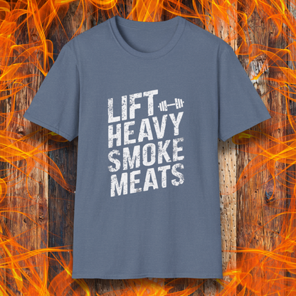 Heather Indigo T-shirt with bold, distressed white text reading 'Lift Heavy Smoke Meats,' featuring a barbell icon. A perfect fit for BBQ lovers and gym enthusiasts who take their grilling and gains seriously!