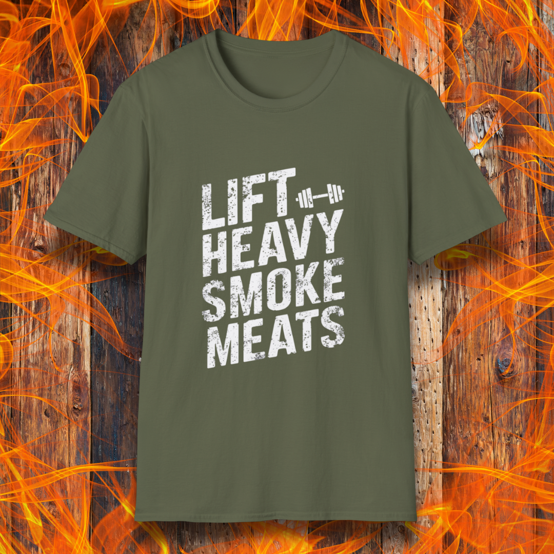 Military Green T-shirt with bold, distressed white text reading 'Lift Heavy Smoke Meats,' featuring a barbell icon. A perfect fit for BBQ lovers and gym enthusiasts who take their grilling and gains seriously!