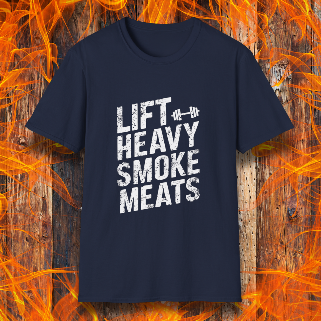 Navy T-shirt with bold, distressed white text reading 'Lift Heavy Smoke Meats,' featuring a barbell icon. A perfect fit for BBQ lovers and gym enthusiasts who take their grilling and gains seriously!