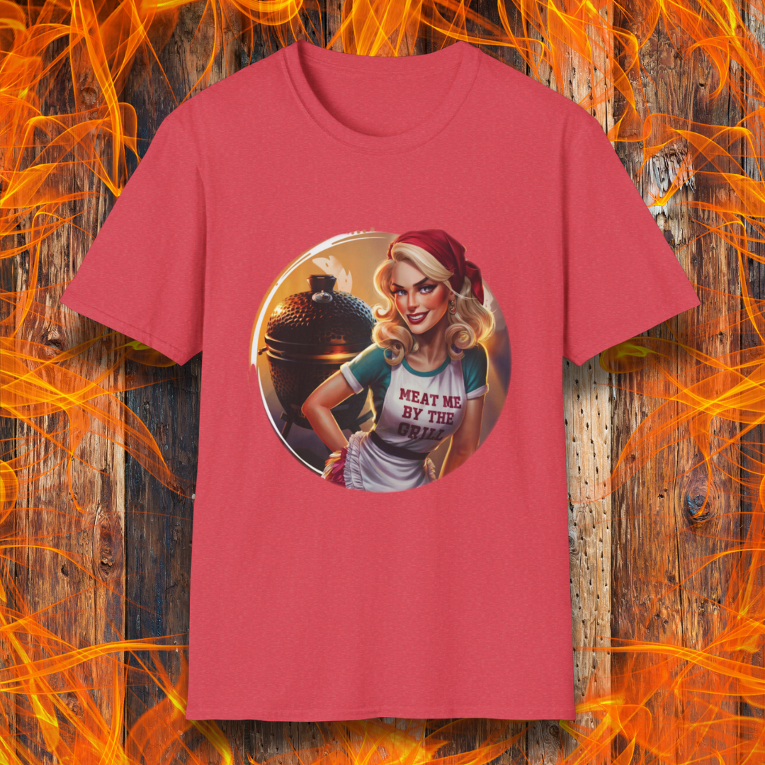 Heather Red  t-shirt featuring a vintage-inspired pin-up style woman in front of a charcoal grill, wearing an apron that reads 'Meat Me By The Grill.