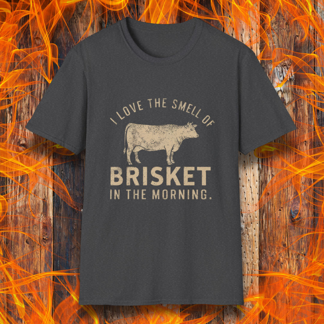 Dark Heather T-shirt featuring vintage-style text that reads 'I Love the Smell of Brisket in the Morning,' along with a rustic, hand-drawn cow illustration. A must-have for BBQ lovers and brisket enthusiasts!