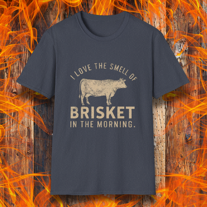 Heather Navy T-shirt featuring vintage-style text that reads 'I Love the Smell of Brisket in the Morning,' along with a rustic, hand-drawn cow illustration. A must-have for BBQ lovers and brisket enthusiasts!