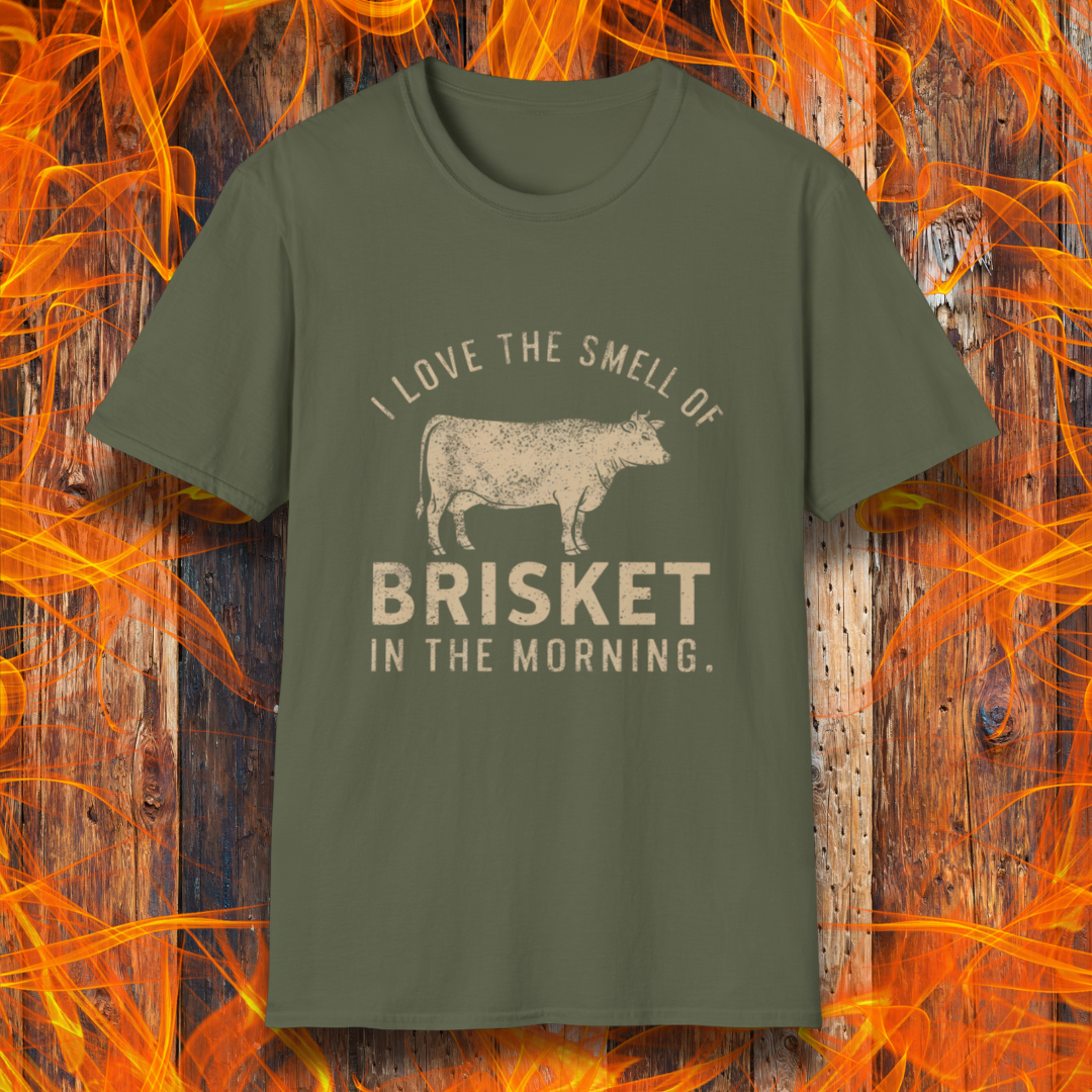 Military Green T-shirt featuring vintage-style text that reads 'I Love the Smell of Brisket in the Morning,' along with a rustic, hand-drawn cow illustration. A must-have for BBQ lovers and brisket enthusiasts!