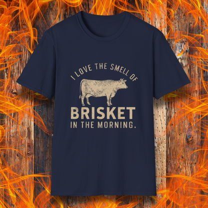 Navy T-shirt featuring vintage-style text that reads 'I Love the Smell of Brisket in the Morning,' along with a rustic, hand-drawn cow illustration. A must-have for BBQ lovers and brisket enthusiasts!