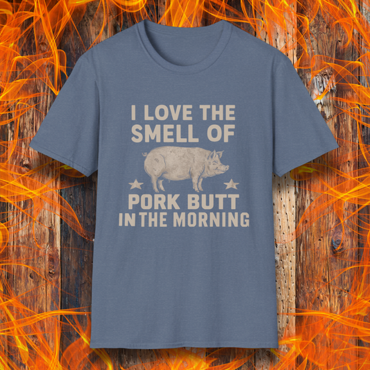 Heather Indigo T-shirt with bold beige text reading 'I Love the Smell of Pork Butt in the Morning,' featuring a vintage-style pig illustration and star accents. Perfect for BBQ enthusiasts and pitmasters!