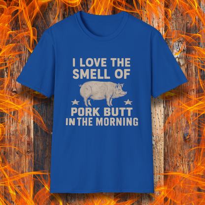 Royal Blue T-shirt with bold beige text reading 'I Love the Smell of Pork Butt in the Morning,' featuring a vintage-style pig illustration and star accents. Perfect for BBQ enthusiasts and pitmasters!