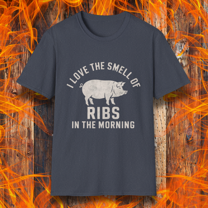 Heather Navy T-shirt featuring a vintage-style design with the phrase 'I Love the Smell of Ribs in the Morning' and a rustic, hand-drawn pig illustration. Perfect for BBQ pitmasters and rib lovers!