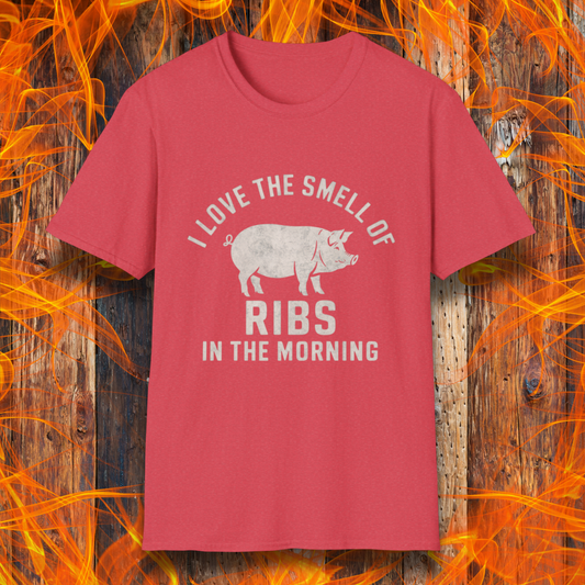 Heather Red T-shirt featuring a vintage-style design with the phrase 'I Love the Smell of Ribs in the Morning' and a rustic, hand-drawn pig illustration. Perfect for BBQ pitmasters and rib lovers!